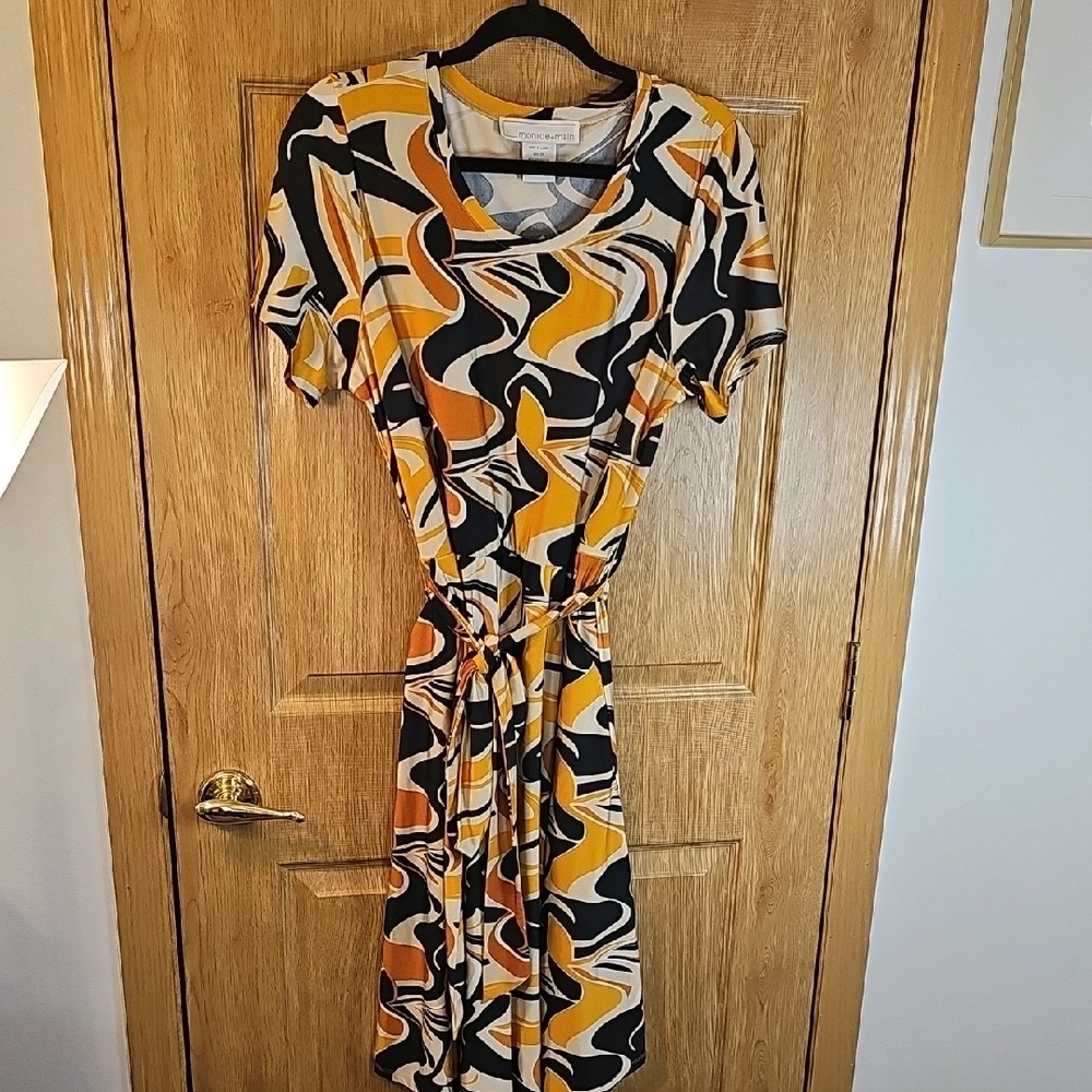 Chic Abstract Midi Dress in Black, Orange, and Cream